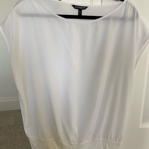 Sheer white blouse with stretchy hem.